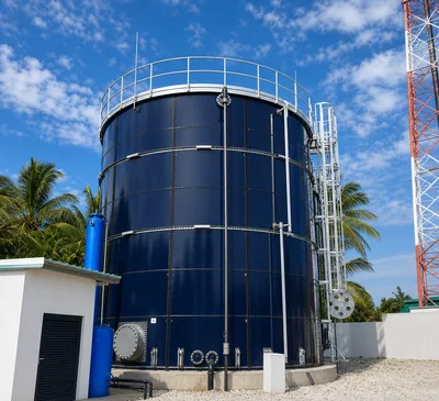 Kenya drinking water storage tank project with dark blue epoxy coated bolted steel tank and external ladder